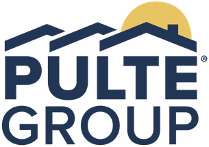 Professional documentary photograph of a Del Webb active-adult residential community under construction in Indio, California, desert-style single-story homes with stucco exteriors and tile roofing in various framing stages, palm trees and mountains in the background, bright daylight, high detail